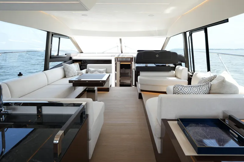 Slide: The Image of Luxurious interior of 2023 Prestige 590 yacht with elegant seating and ocean view. - 1