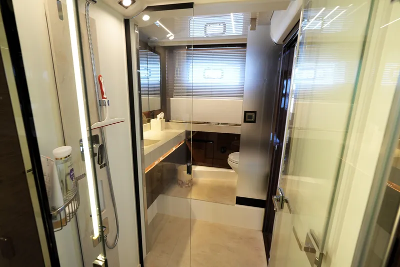 Slide: The Image of Luxurious bathroom interior of 2023 Prestige 590 yacht, featuring modern fixtures and elegant design. - 86