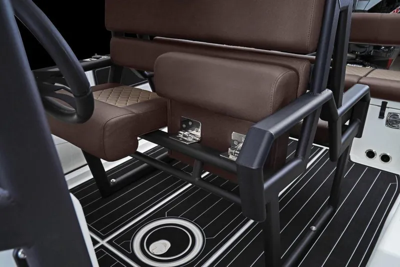 Slide: The Image of Interior of 2027 Brig Navigator 24 boat with brown seating and black frame. - 5