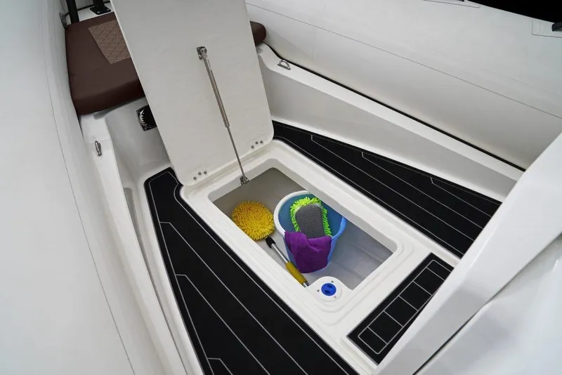 Slide: The Image of Storage compartment on 2027 Brig Navigator 24 boat with cleaning supplies. - 4