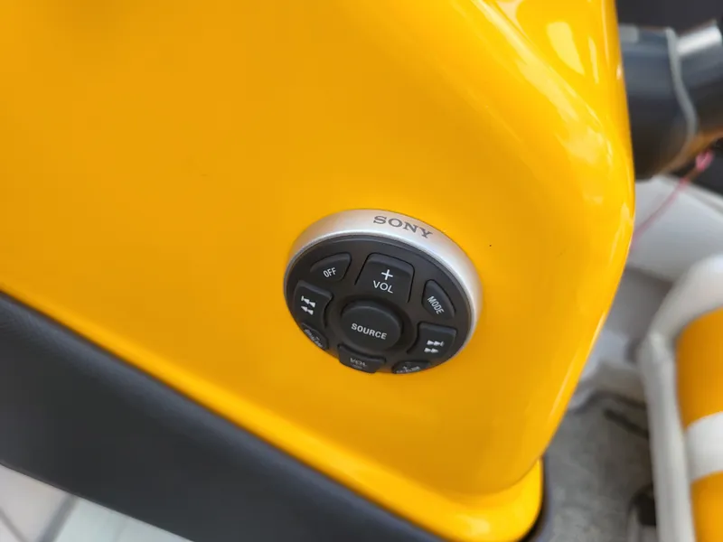Slide: The Image of Close-up of a yellow boat panel with Sony controls. - 20