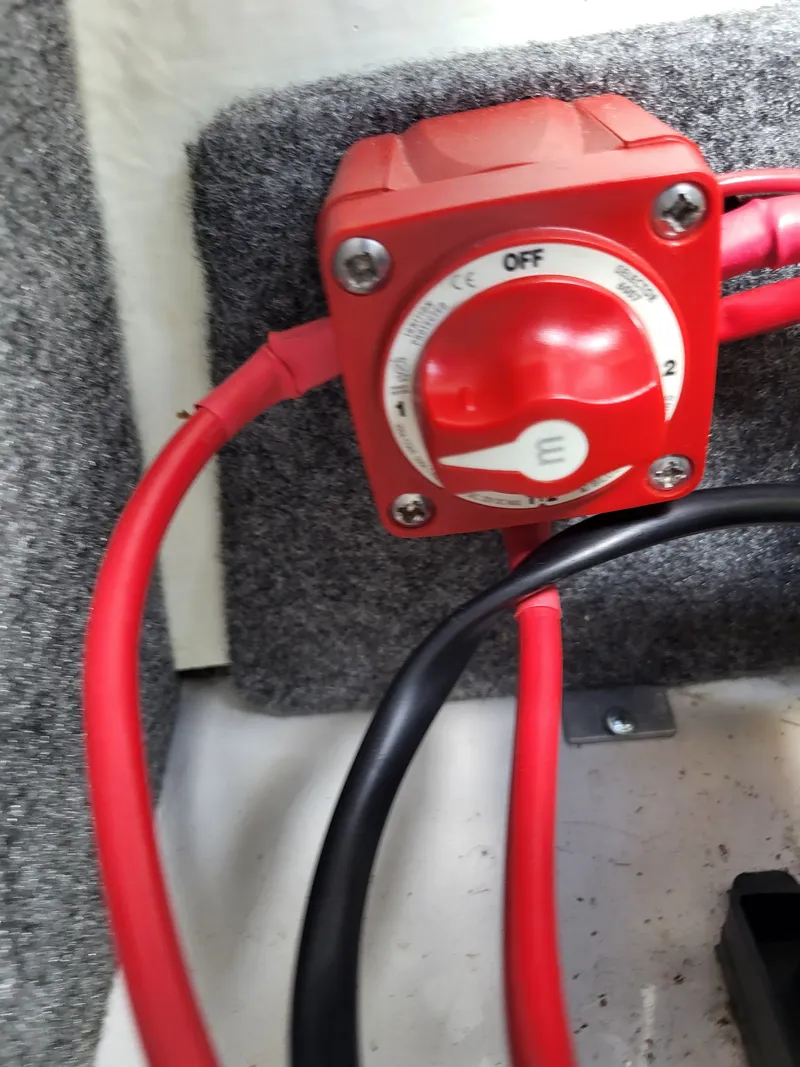 Slide: The Image of Close-up of a battery switch with red and black cables. - 25