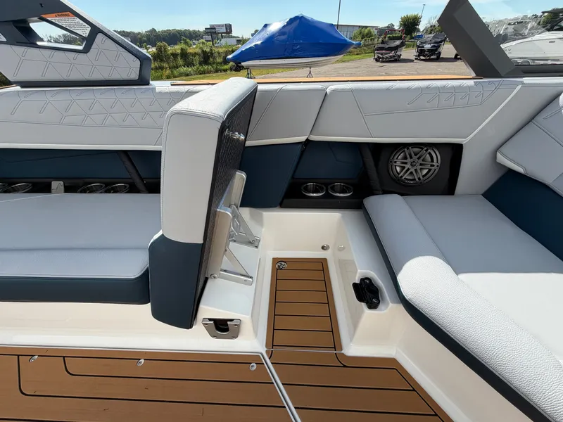 Slide: The Image of The image shows the interior of a modern boat with sleek seating and wood flooring. - 30