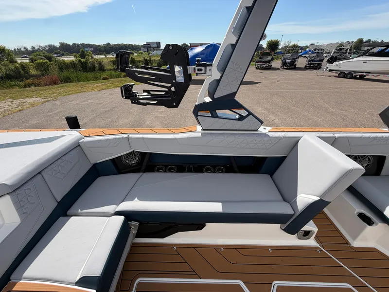 Slide: The Image of The image shows the interior of a 2027 Nautique S25 Super Air with sleek seating. - 26
