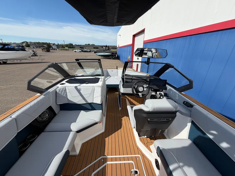 Slide: The Image of The image shows the interior of a modern boat with sleek seating and a stylish helm. - 31