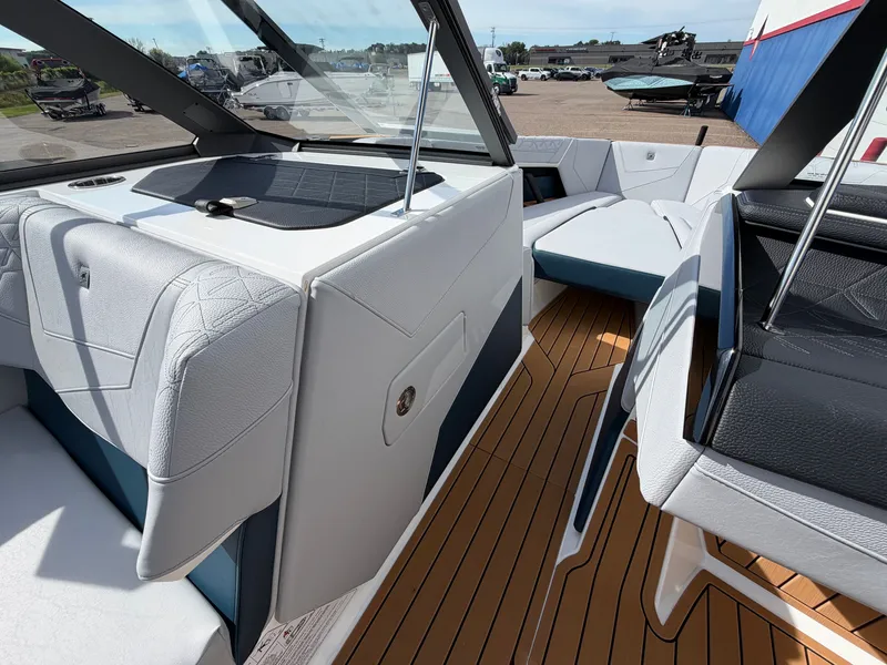 Slide: The Image of The image shows the interior of a modern boat with sleek seating and wooden flooring. - 42