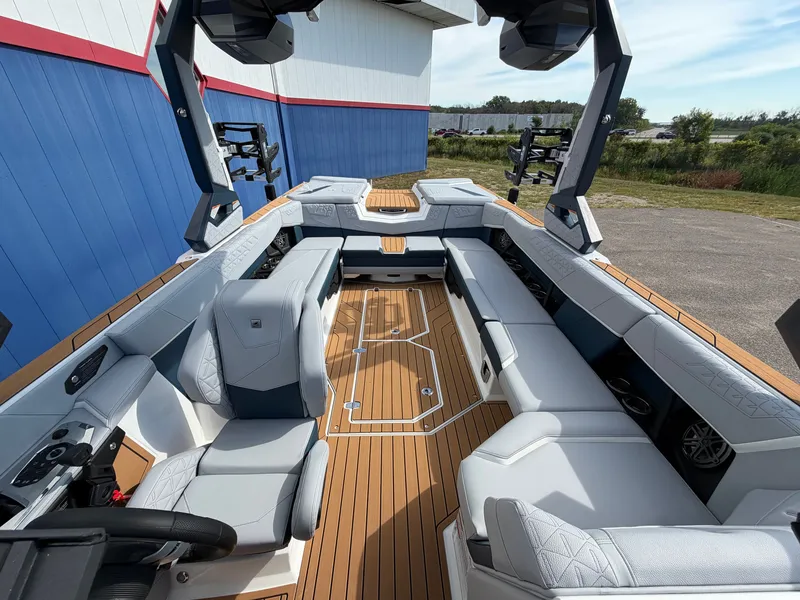 Slide: The Image of The image shows the interior of a 2027 Nautique S25 Super Air with sleek seating and modern design. - 47