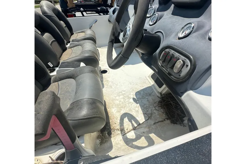 Slide: The Image of Interior view of a 2012 Nitro Z-7 boat with seats and a steering console. - 10
