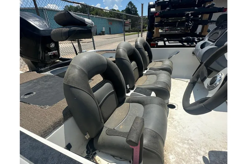 Slide: The Image of Interior view of a 2012 Nitro Z-7 boat with four padded seats and a steering wheel. - 9
