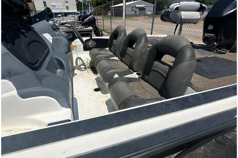 Slide: The Image of The image shows the cockpit of a Nitro Z-7 boat with four black seats. - 4