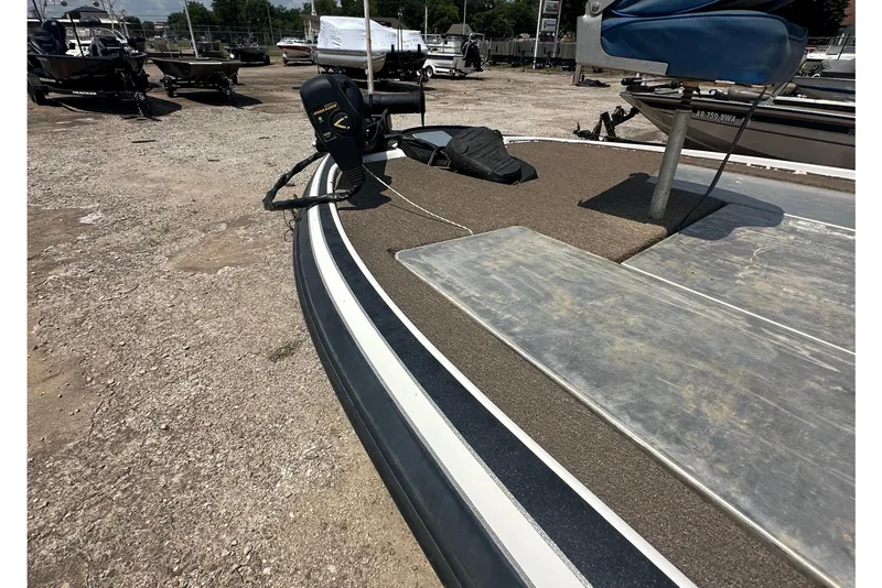 Slide: The Image of A 2012 Nitro Z-7 boat on a dry dock with a motor and seat. - 11