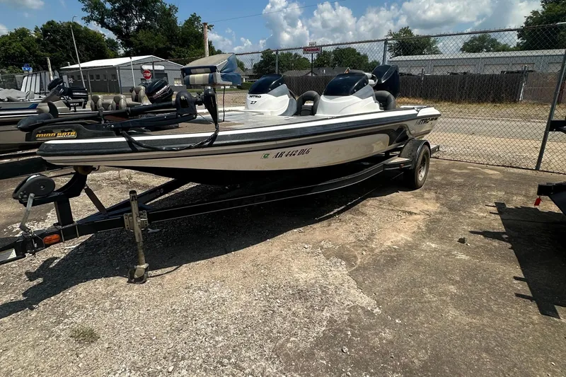 Slide: The Image of A 2012 Nitro Z-7 boat is on a trailer in a parking area. - 1