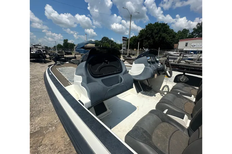Slide: The Image of The image shows a 2012 Nitro Z-7 boat with two seats and a helm station. - 7