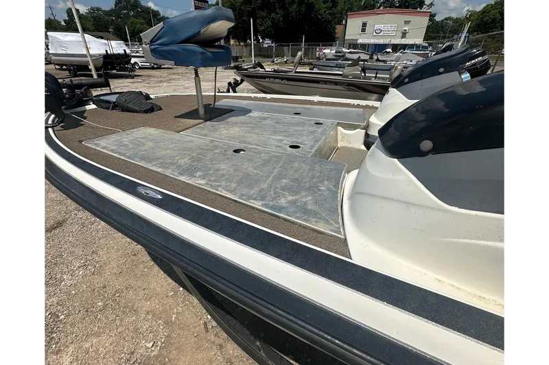 Slide: The Image of A 2012 Nitro Z-7 boat on a dry dock with several other boats in the background. - 3