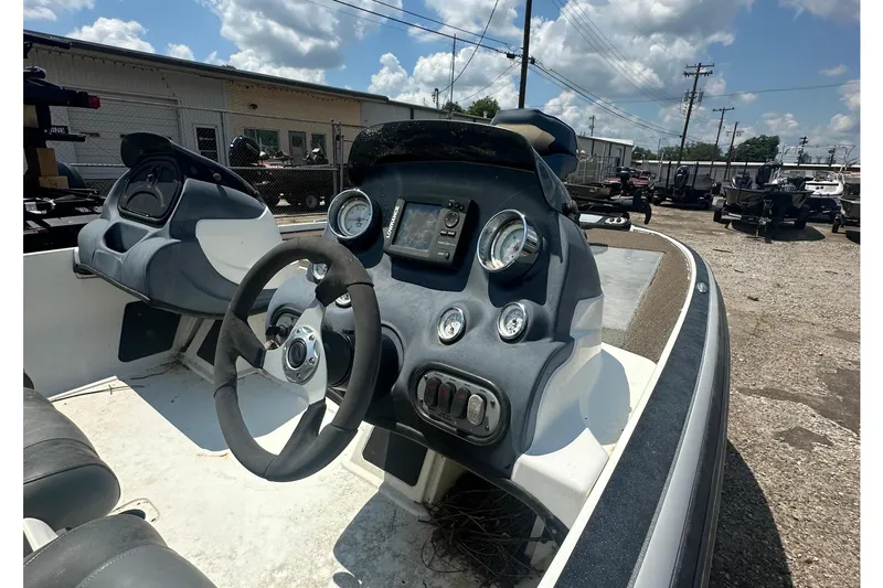 Slide: The Image of The image shows the cockpit of a 2012 Nitro Z-7 boat with steering wheel and gauges. - 8