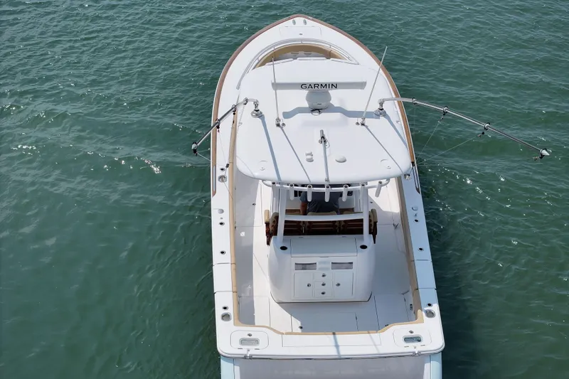 Slide: The Image of Aerial view of 2023 Phenom 34 boat on water, featuring Garmin equipment. - 13