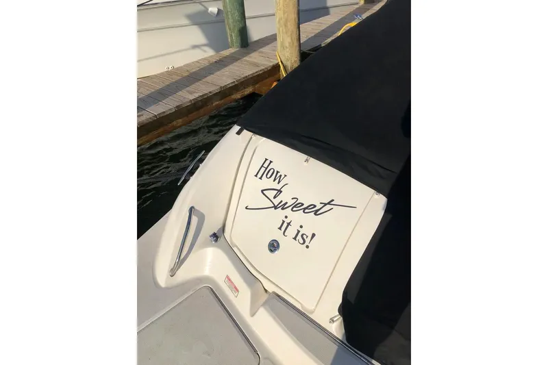 Slide: The Image of 2005 Sea Ray 290 SLX boat with "How Sweet it is!" text on the deck. - 21