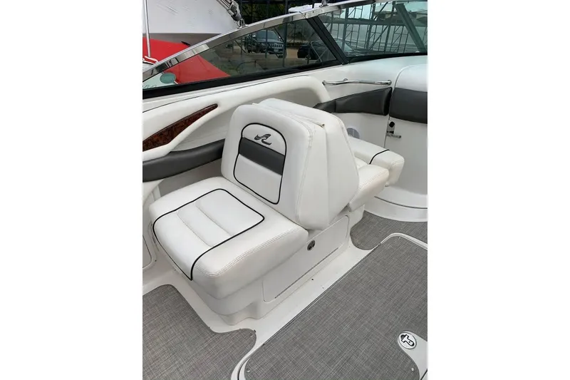 Slide: The Image of 2005 Sea Ray 290 SLX boat interior with white leather seating and sleek design. - 7