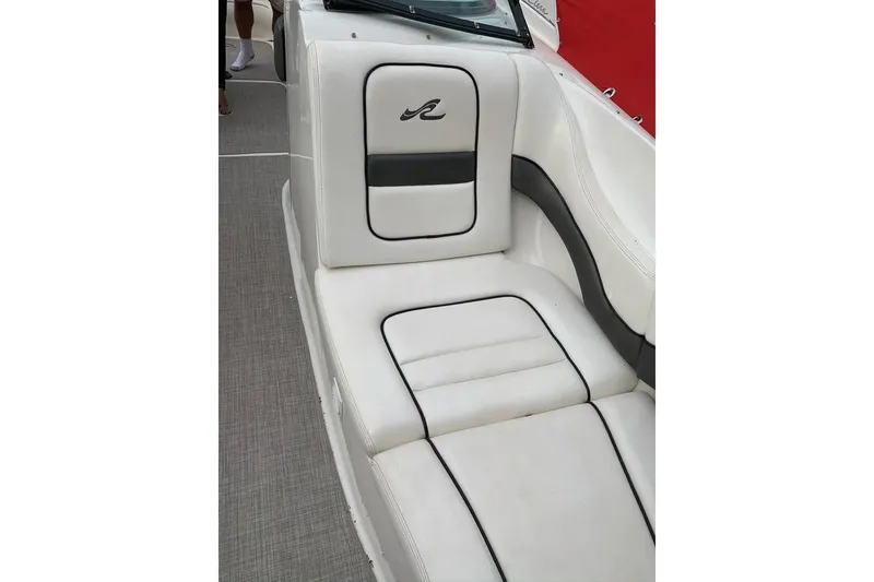 Slide: The Image of Luxurious white seating on a 2005 Sea Ray 290 SLX boat interior. - 13