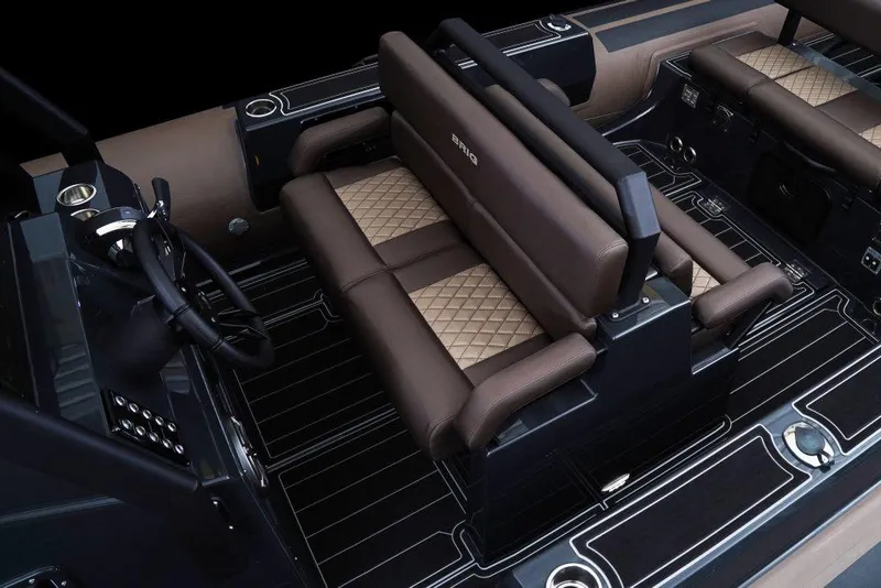 Slide: The Image of Luxurious interior of 2027 Brig Navigator 26 boat with brown leather seating and modern controls. - 5