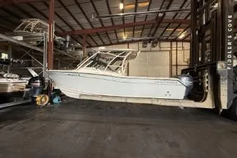The Image of 2021 Grady-White Freedom 275 boat in storage facility, side view. - 1