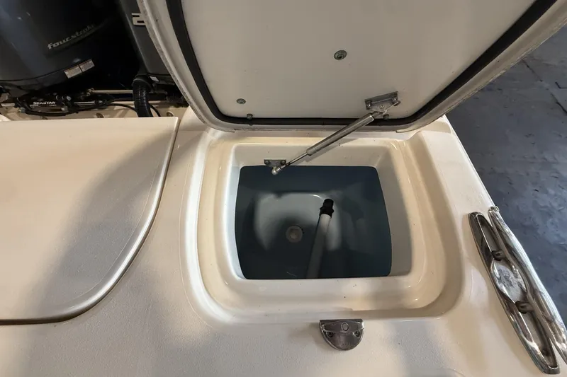 Slide: The Image of Open storage compartment on a 2021 Grady-White Freedom 275 boat. - 10