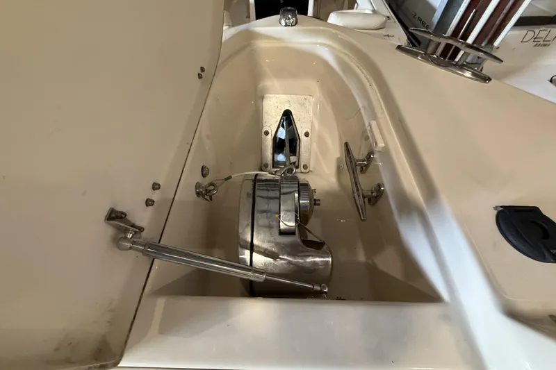 Slide: The Image of 2021 Grady-White Freedom 275 boat anchor compartment with stainless steel fittings. - 9