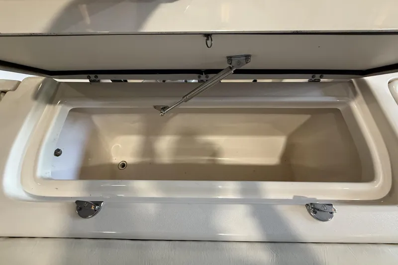 Slide: The Image of Open storage compartment on a 2021 Grady-White Freedom 275 boat. - 11
