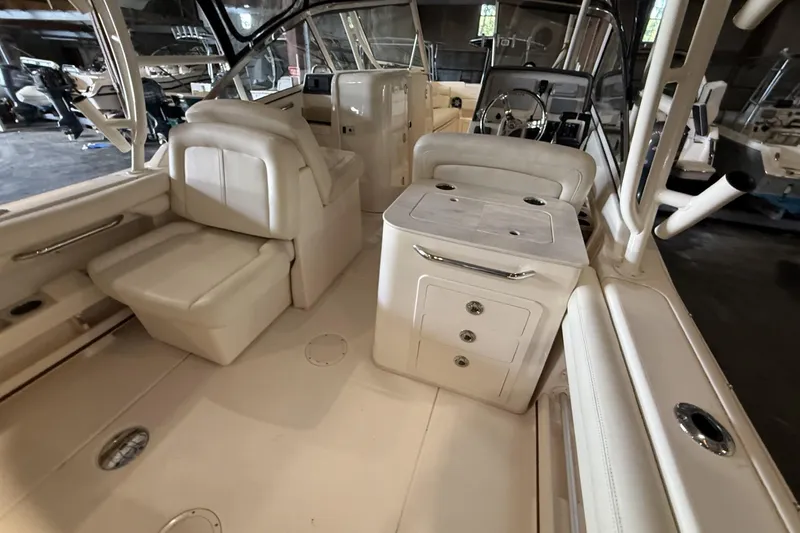Slide: The Image of 2021 Grady-White Freedom 275 boat interior with luxurious seating and modern amenities. - 4