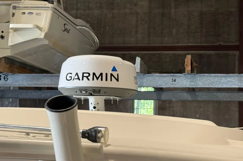 Slide: The Image of 2021 Grady-White Freedom 275 with Garmin radar in storage facility. - 15