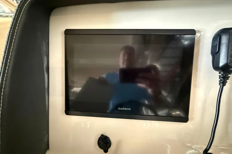 Slide: The Image of Garmin display on 2021 Grady-White Freedom 275 boat dashboard. - 13