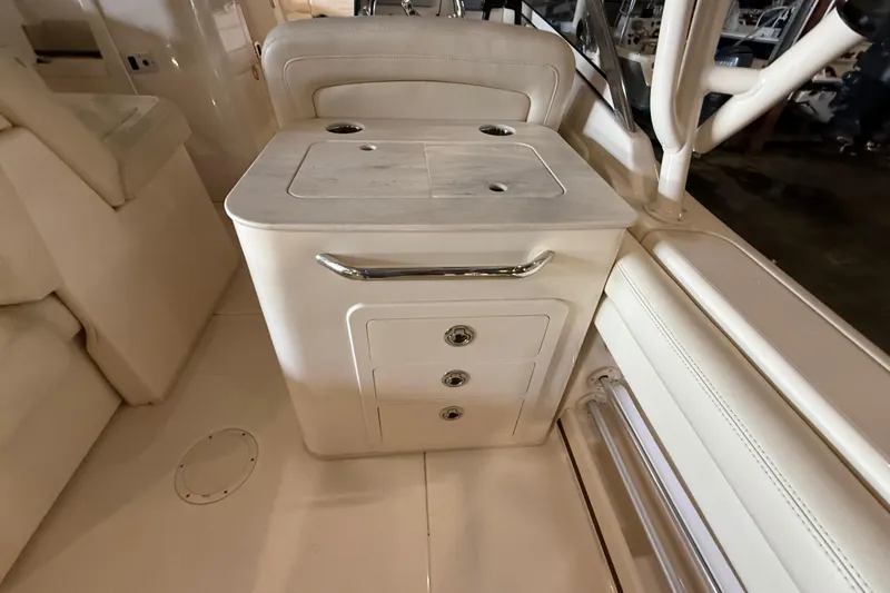 Slide: The Image of Interior of 2021 Grady-White Freedom 275 boat with storage drawers and seating. - 17
