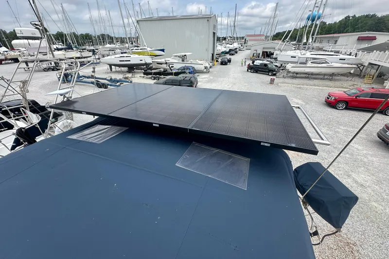 Slide: The Image of Solar panels on a 2002 Beneteau Oceanis Clipper 473 yacht in a marina. - 35