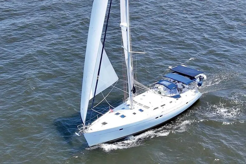 Slide: The Image of Sailing yacht Beneteau Oceanis Clipper 473, 2002 model, cruising on open water. - 1