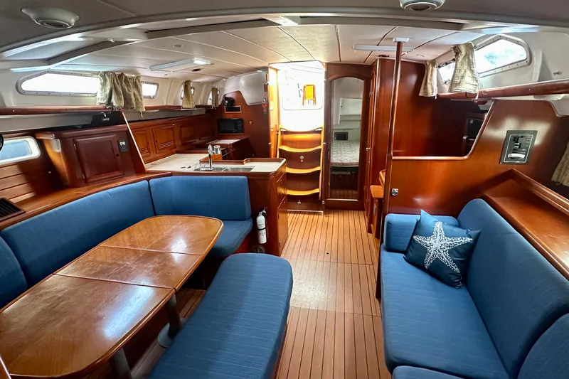Slide: The Image of Luxurious interior of 2002 Beneteau Oceanis Clipper 473 yacht with elegant wood finish. - 28