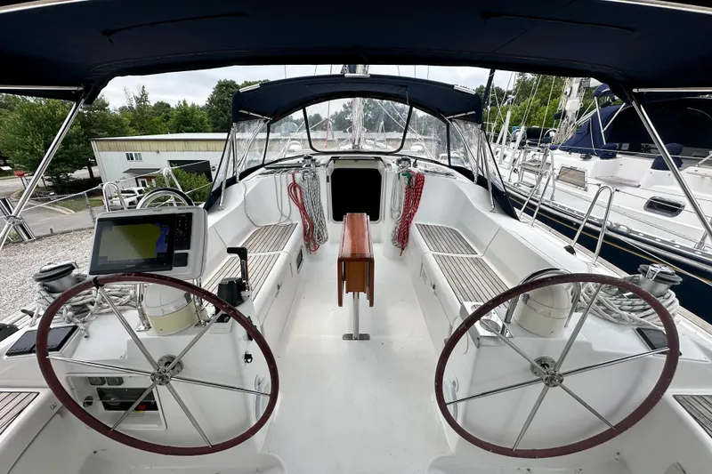 Slide: The Image of Cockpit view of 2002 Beneteau Oceanis Clipper 473 sailboat with dual steering wheels. - 11