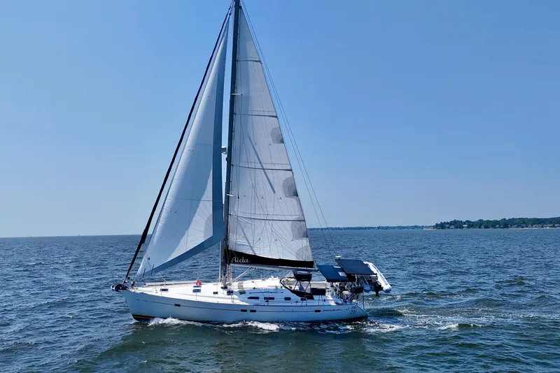 Slide: The Image of Sailing yacht Beneteau Oceanis Clipper 473, 2002 model, cruising on open water. - 2
