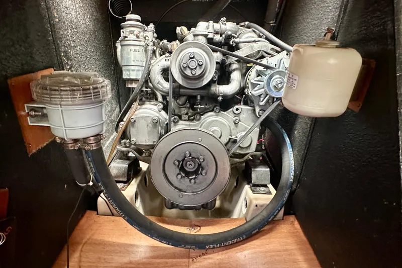 Slide: The Image of Engine compartment of a 2002 Beneteau Oceanis Clipper 473 sailboat, showcasing mechanical components. - 33