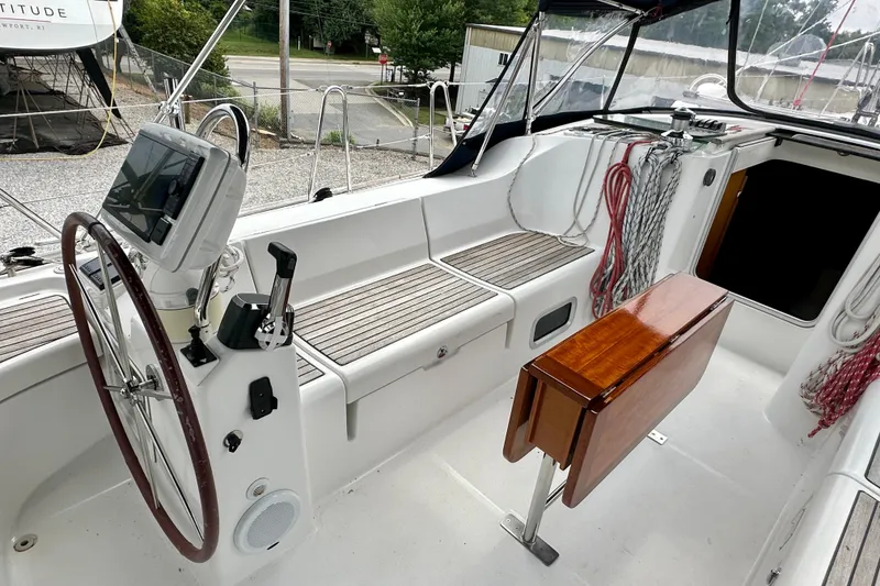 Slide: The Image of Cockpit of 2002 Beneteau Oceanis Clipper 473 sailboat with steering wheel and navigation equipment. - 14