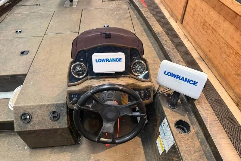 Slide: The Image of 2021 G3 Sportsman 1910 boat dashboard with Lowrance electronics and steering wheel. - 8