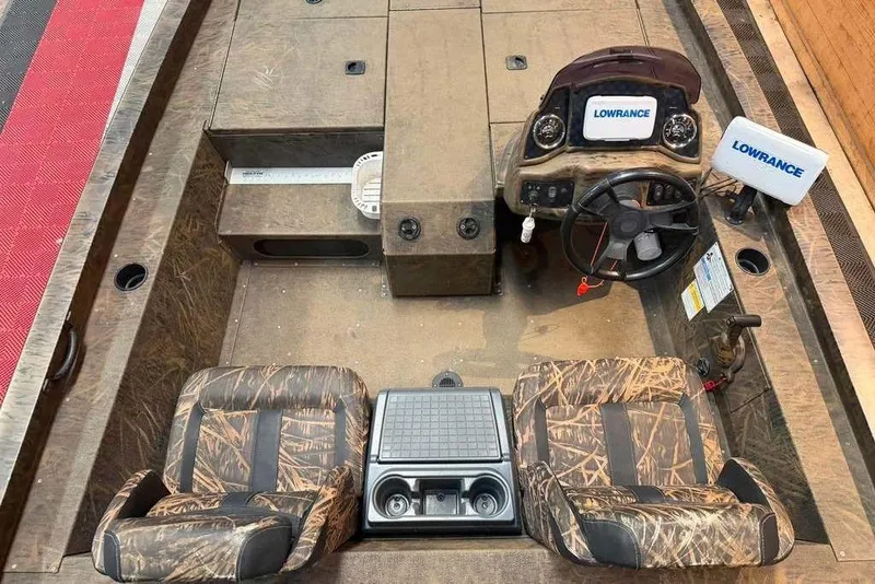 Slide: The Image of 2021 G3 Sportsman 1910 boat interior with camo seats and Lowrance electronics. - 4