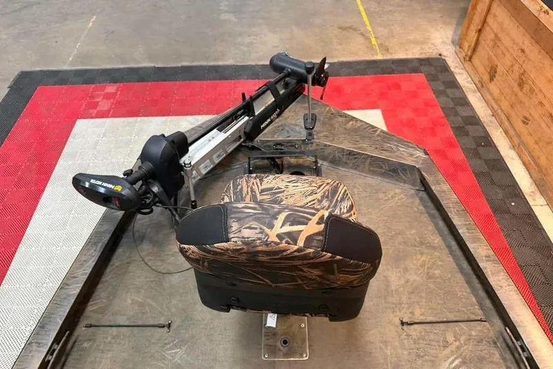 Slide: The Image of 2021 G3 Sportsman 1910 boat with camo seat and trolling motor on display. - 6