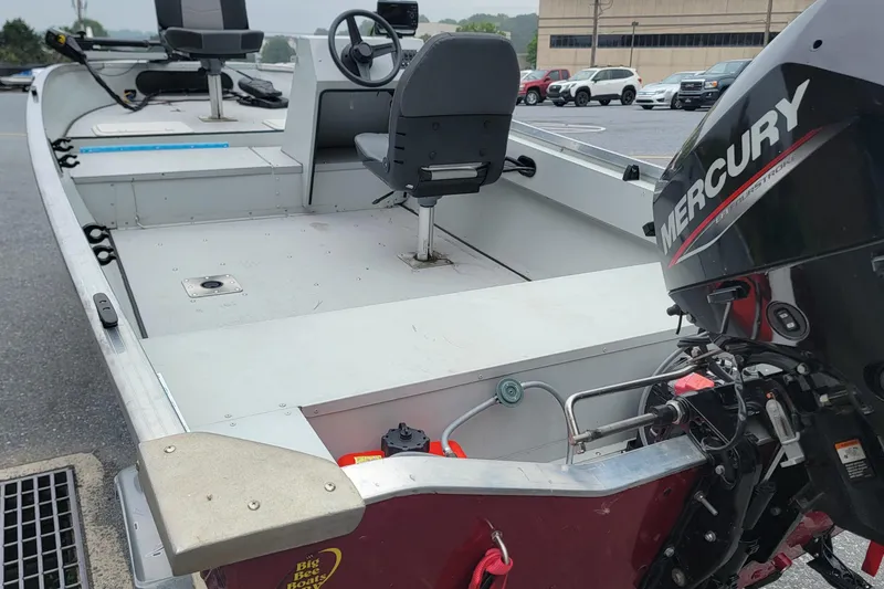 Slide: The Image of 2023 Duranautic V-16 boat with Mercury outboard motor, parked in a lot. - 8