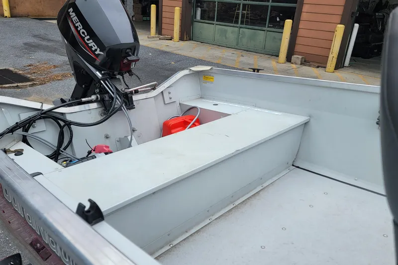 Slide: The Image of 2023 Duranautic V-16 boat interior with Mercury outboard motor and fuel tank. - 5