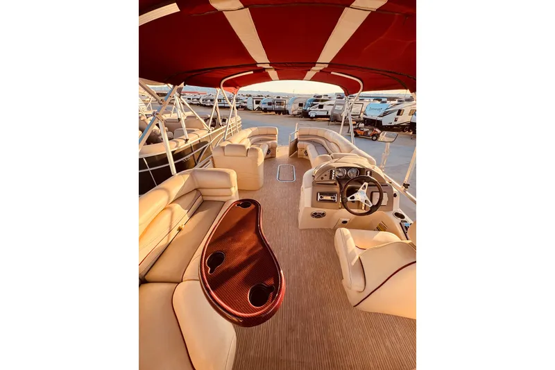 Slide: The Image of Luxurious 2010 Bennington 2375RL pontoon boat interior with plush seating and elegant design. - 14