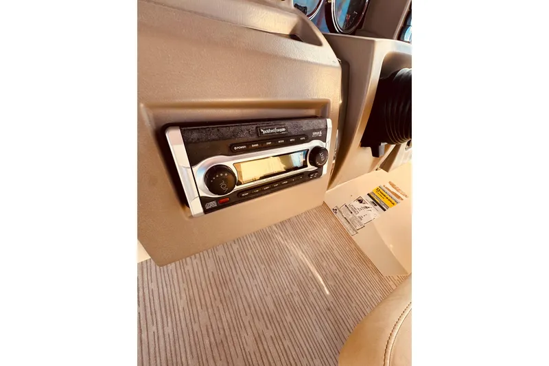 Slide: The Image of 2010 Bennington 2375RL boat dashboard with stereo system and control panel. - 13