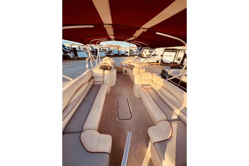 Slide: The Image of Interior view of a 2010 Bennington 2375RL pontoon boat with spacious seating and canopy. - 9