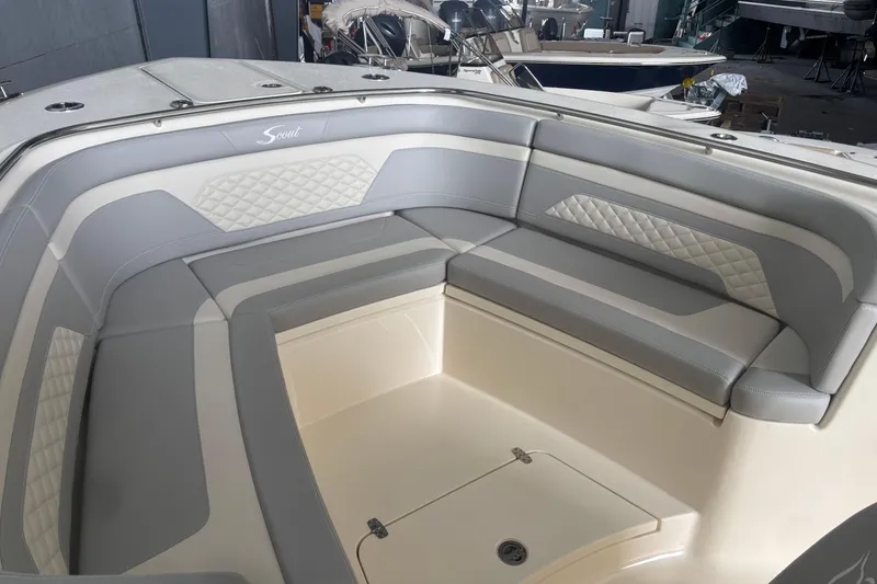Slide: The Image of Luxurious seating area on 2026 Scout 330 LXF boat, featuring elegant gray upholstery. - 19