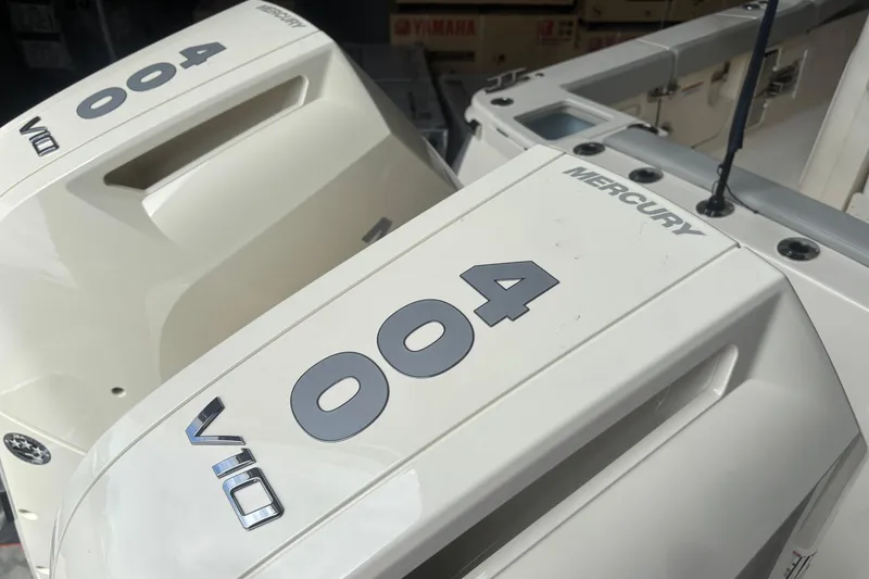 Slide: The Image of 2026 Scout 330 LXF boat with Mercury V10 outboard engines. - 7