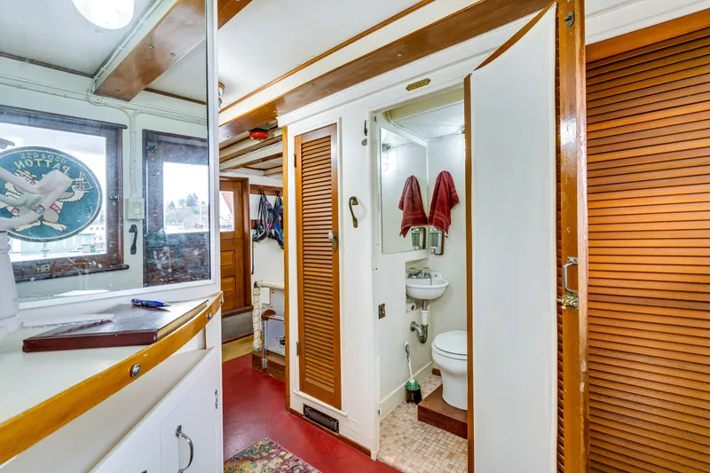 Slide: The Image of Interior of a classic yacht with wooden doors and a small bathroom. - 54